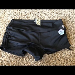 Pink gym to swim black shorts.